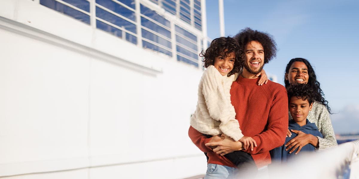 Family enjoying sunset on deck